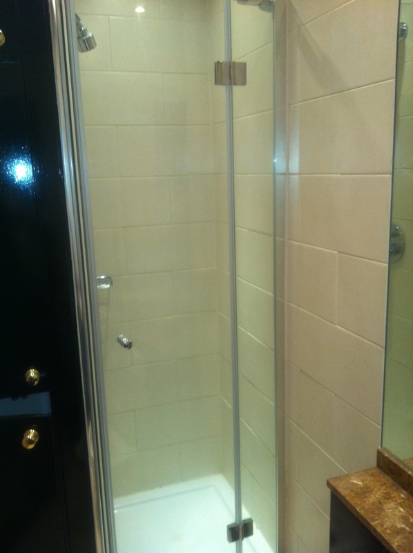Frameless glass shower enclosure with chrome fittings in Windsor