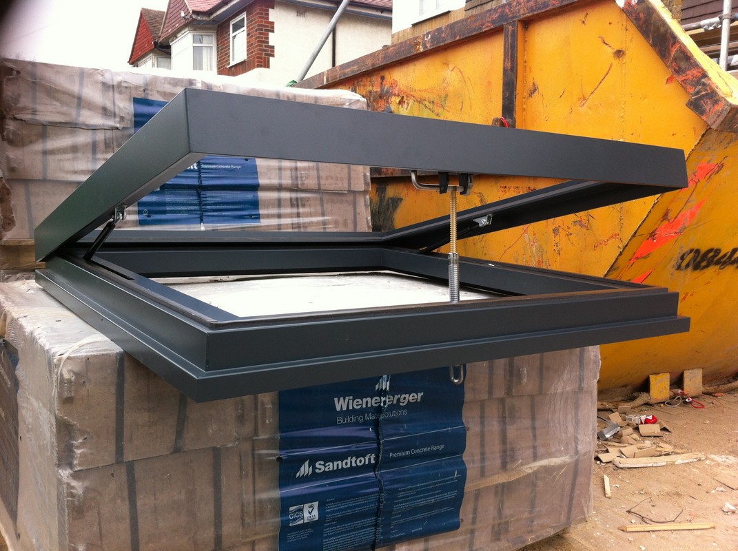 Opening flat roof skylight in anthracite grey installed in Windsor
